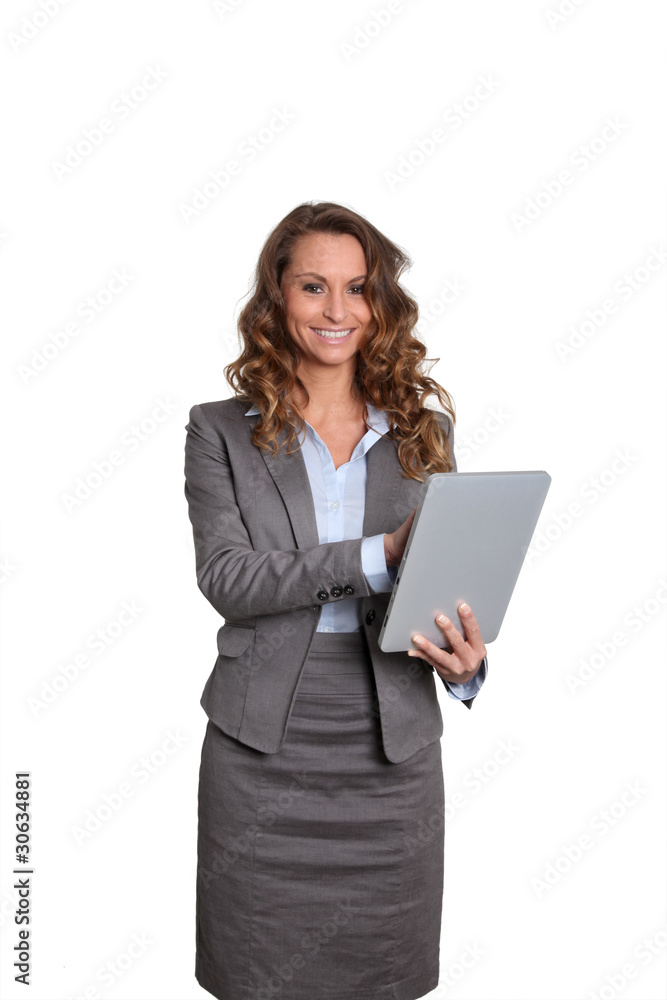 Businesswoman standing on white background with touchpad Businesswoman standing on white background with touchpad