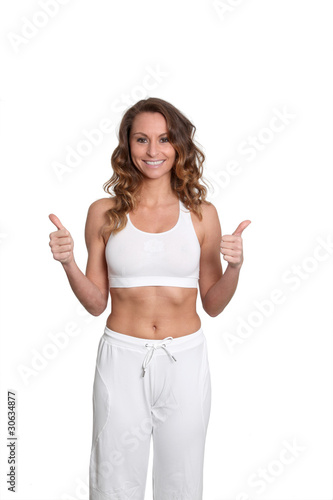 Woman in fitness outfit standing on white background © goodluz