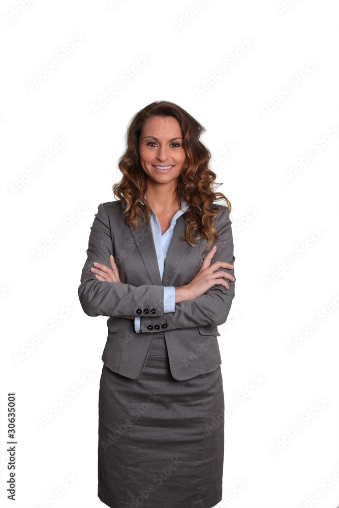 Businesswoman standing on white background with arms crossed Businesswoman standing on white background with arms crossed