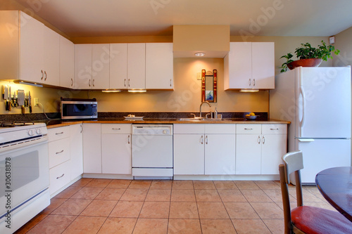 Fototapeta Naklejka Na Ścianę i Meble -  White simple and cozy kitchen