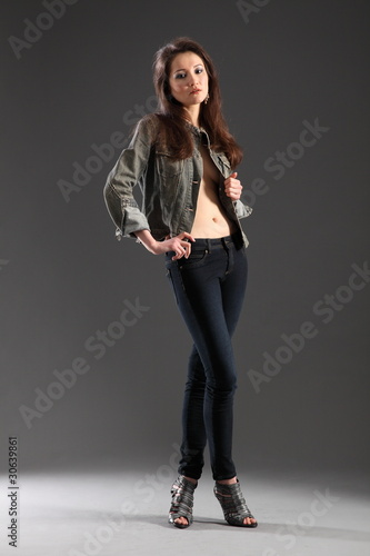 Girl posing in skinny jeans photo