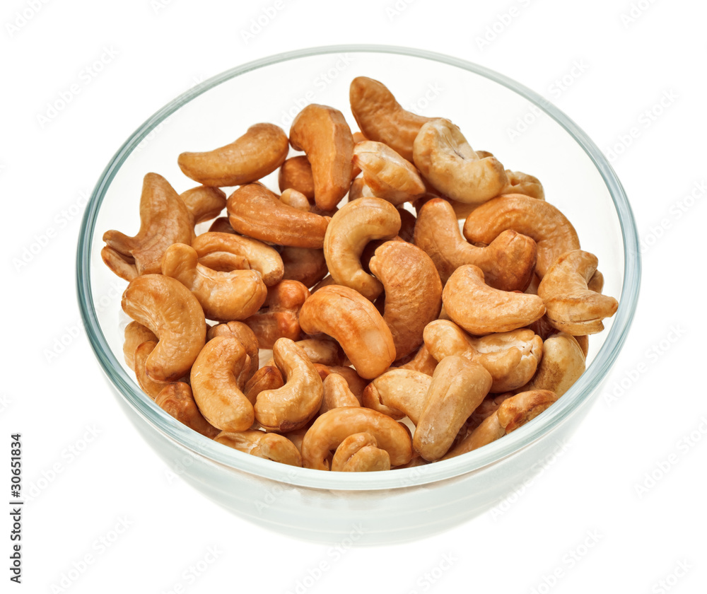 Unshelled cashew nuts in a glass bowl Unshelled cashew nuts in a glass bowl