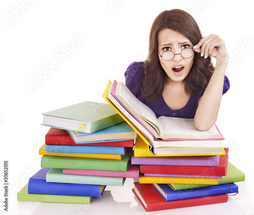 Girl with stack color book . photo