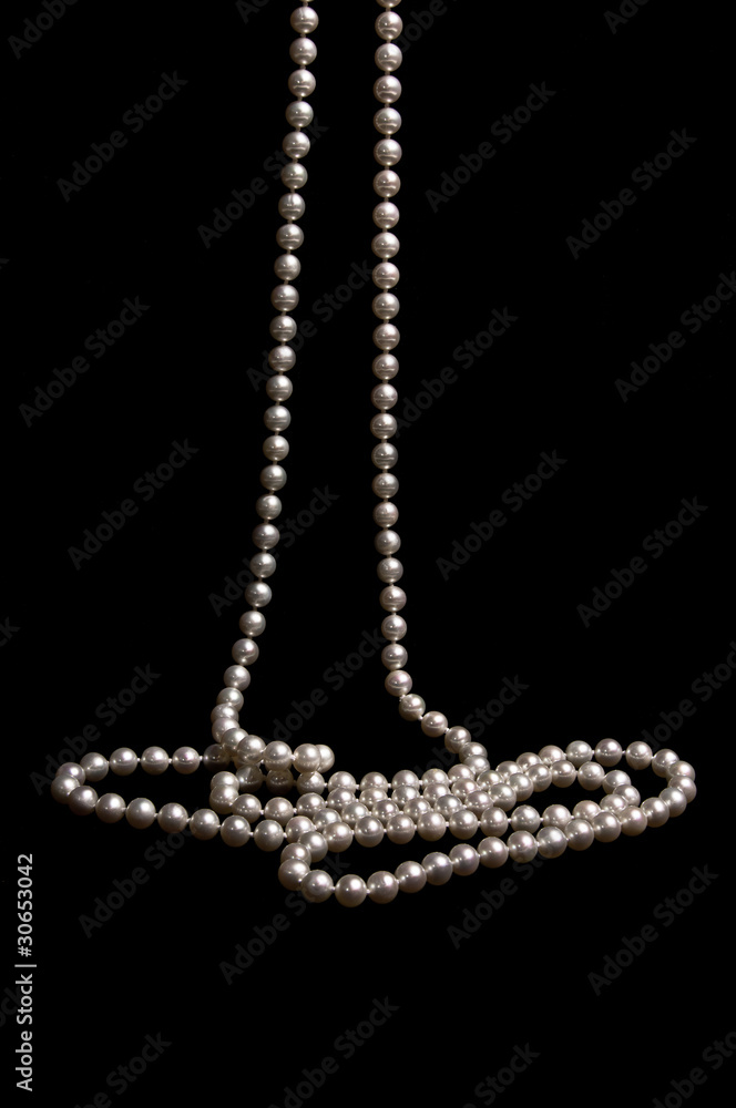 Pearl beads on a black background