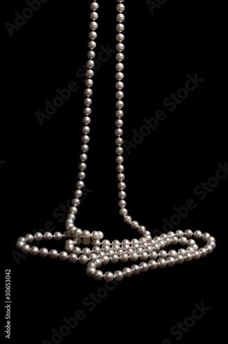 Pearl beads on a black background