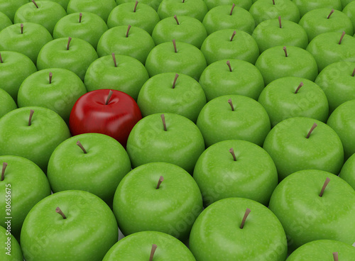 One red apple on a background of green apples