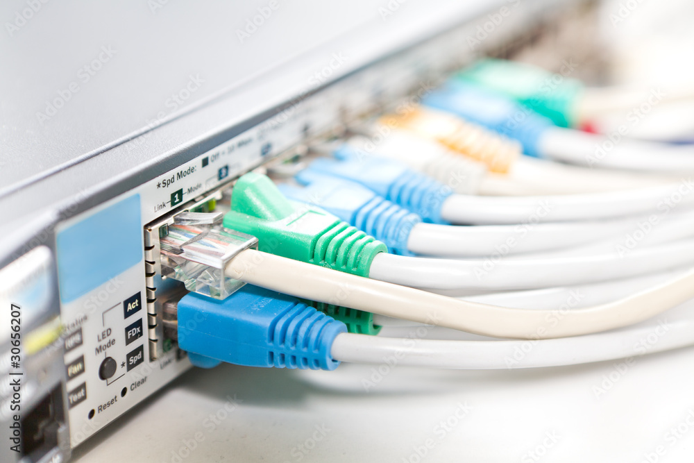 Network cables connected into router, shallow DOF Network cables connected into router, shallow DOF