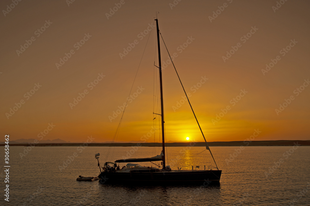Large sailing yacht in sunset