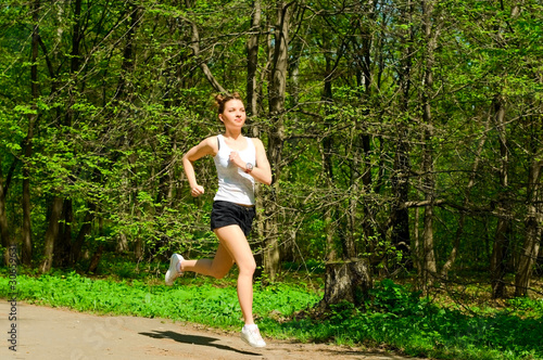 young woman running in park