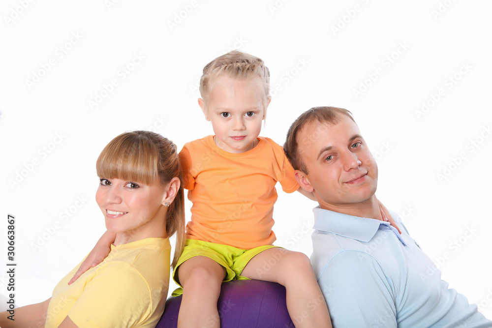 family with a little daughter doing sport together family with a little daughter doing sport together