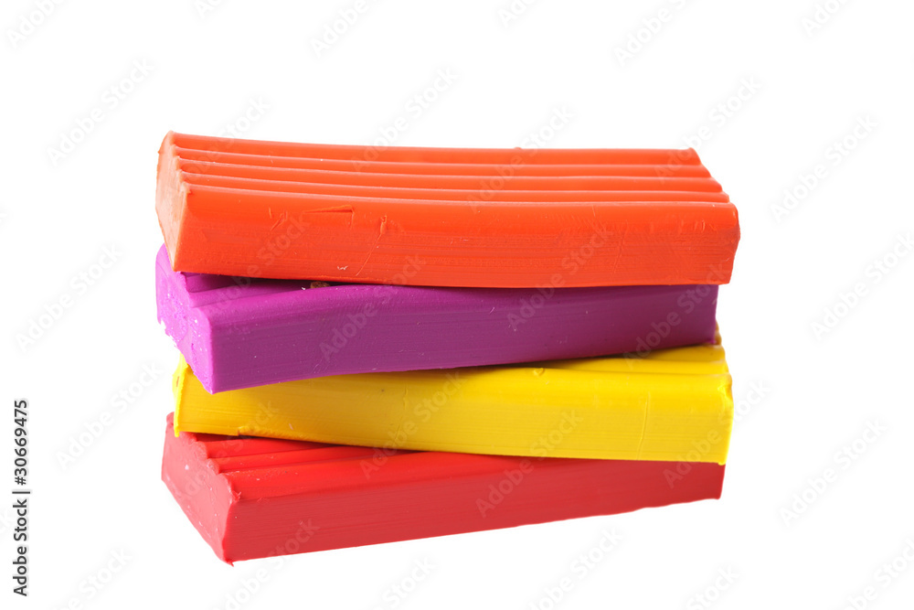Bright color plasticine it is isolated on a white background Bright color plasticine it is isolated on a white background