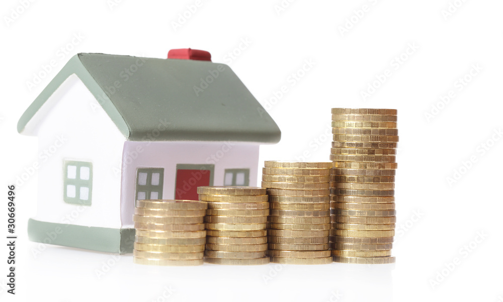 Toy small house and coins in the form of the diagram. Toy small house and coins in the form of the diagram.