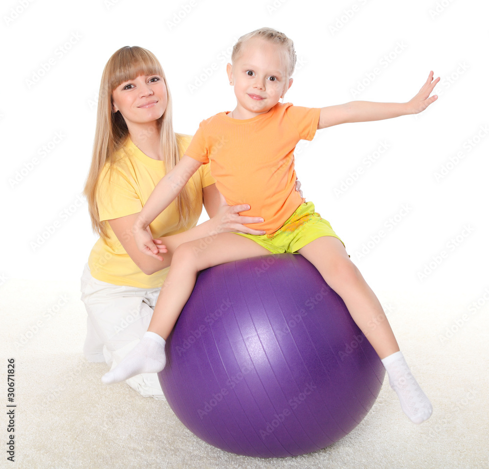 mother and little daughter doing sport together mother and little daughter doing sport together