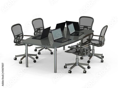 Conference table with laptops