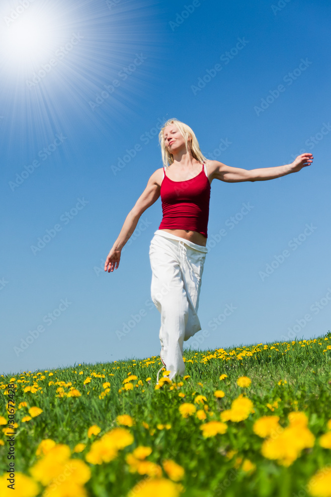 young woman in red outfit having fun on meadow young woman in red outfit having fun on meadow