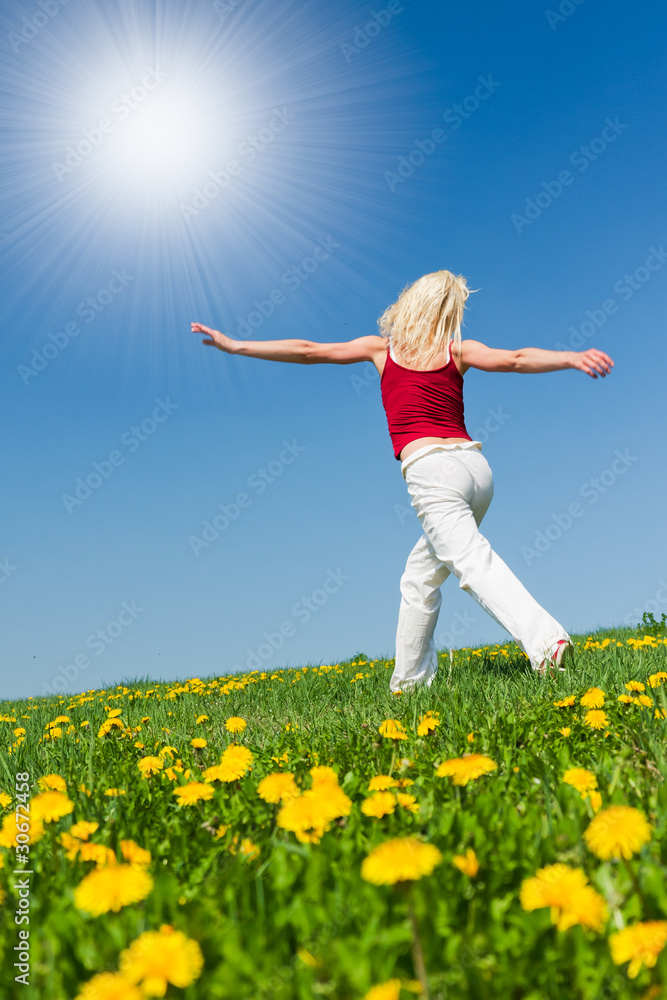 young woman in red outfit having fun on meadow young woman in red outfit having fun on meadow