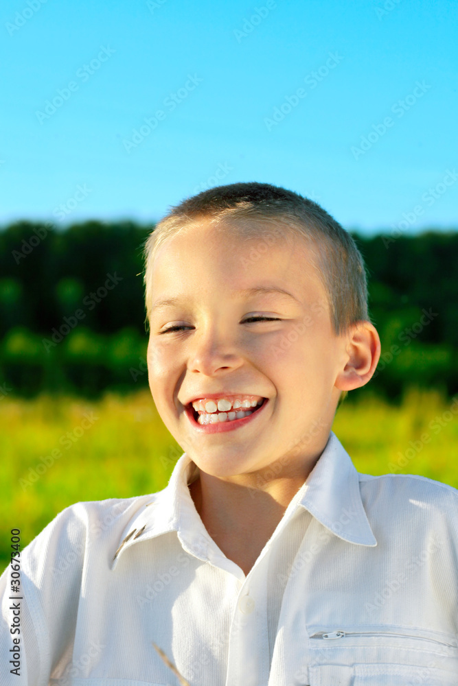 happy boy outdoor in the evening sunlight happy boy outdoor in the evening sunlight