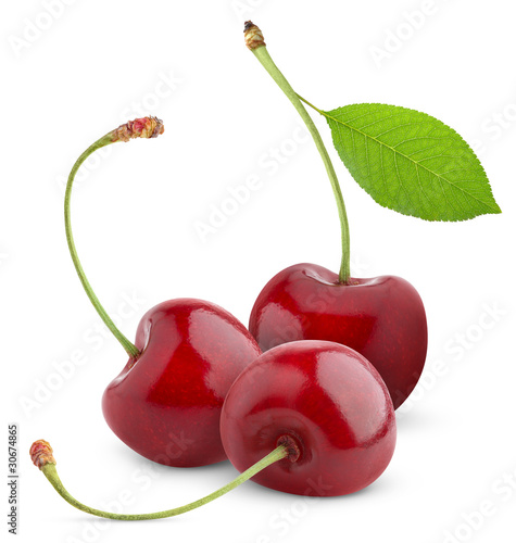 Isolated cherries. Three sweet cherry fruits with leaf isolated on white background