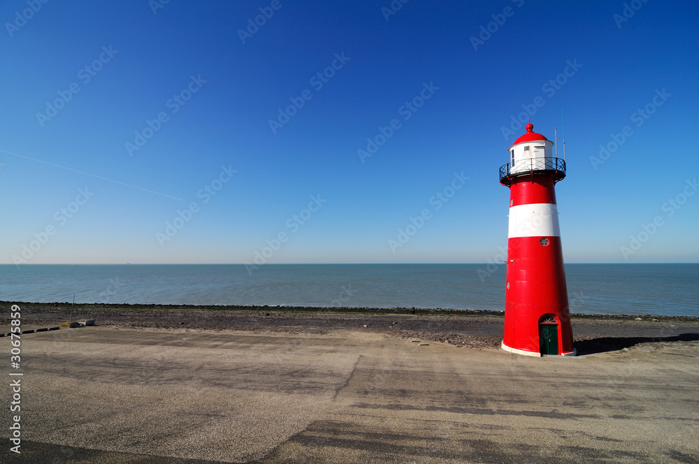 Red lighthouse in Zeeland, Netherlands