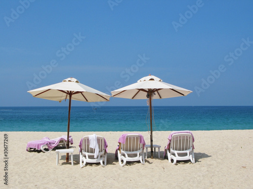 Sun umbrellas and chairs on the Bang Tao beach of Phuket island