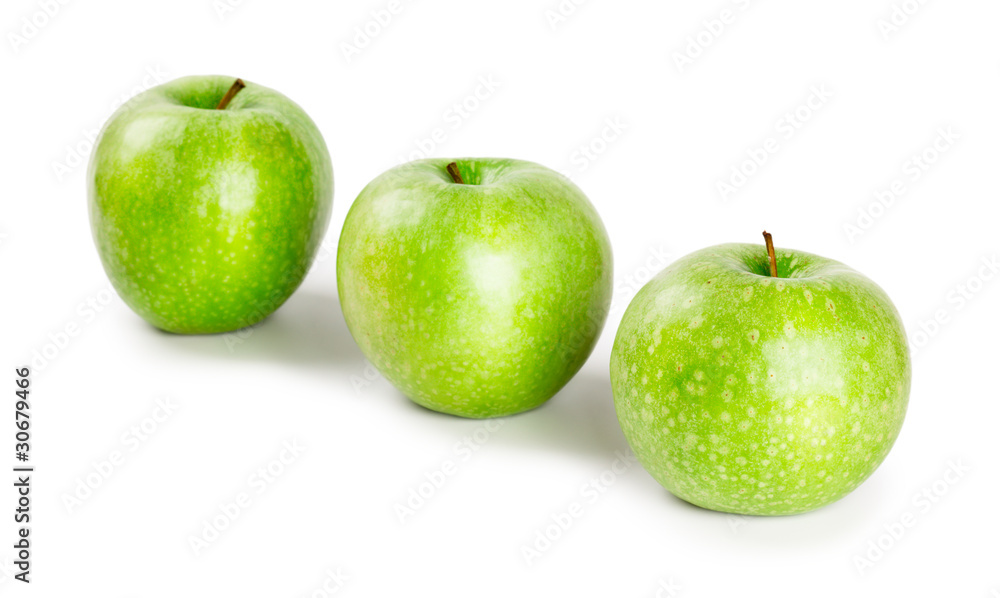 Three ripe and juicy green apples located in a line isolated Three ripe and juicy green apples located in a line isolated