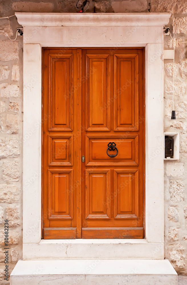Orange wooden doors in Dubrovnik, Croatia