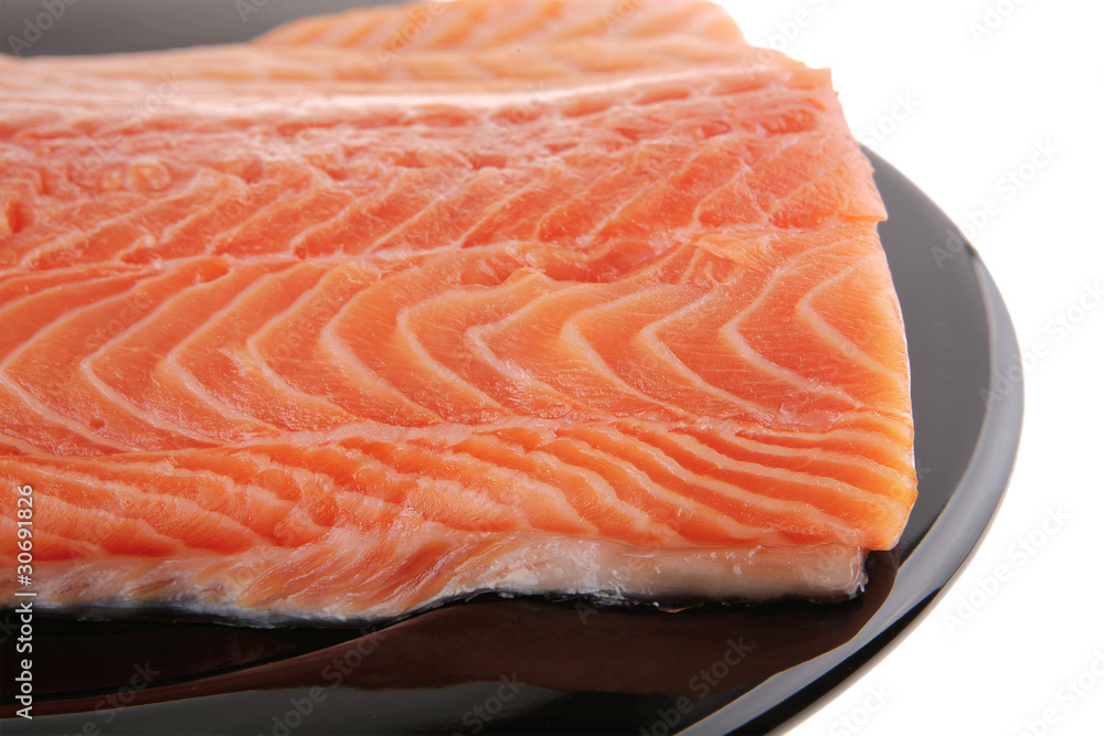 fresh uncooked red fish fillet on black fresh uncooked red fish fillet on black