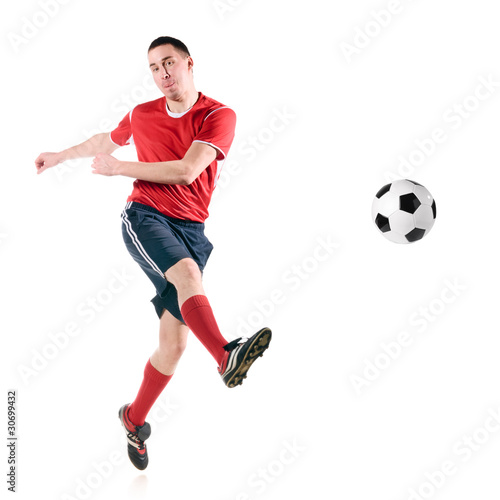 Fototapeta Naklejka Na Ścianę i Meble -  soccer player hits the ball