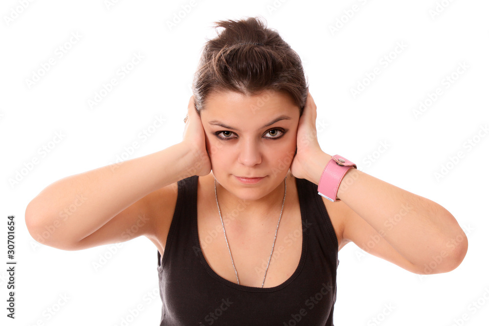 girl the teenager has closed hands ears, isolated. girl the teenager has closed hands ears, isolated.