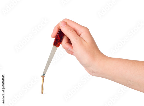 The woman twists a screw a nail file