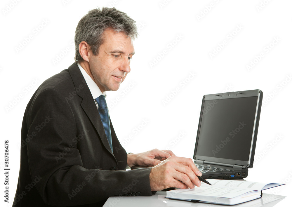 Senior business man working on laptop Senior business man working on laptop