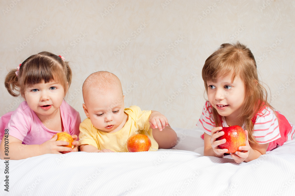 Three children with apples Three children with apples