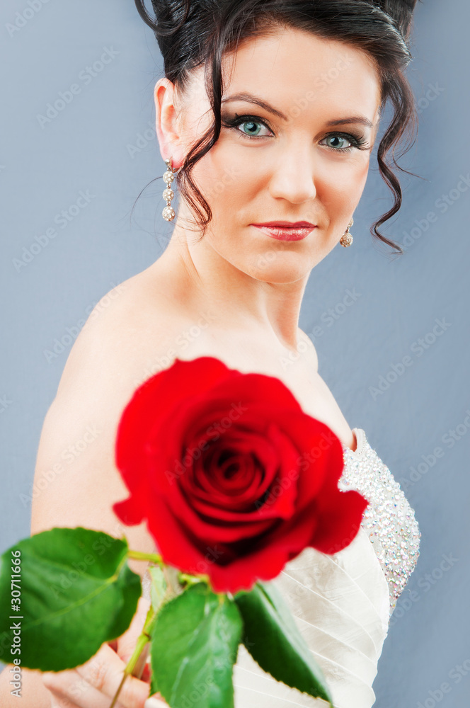 Beautiful bride with rose in studio shooting Beautiful bride with rose in studio shooting
