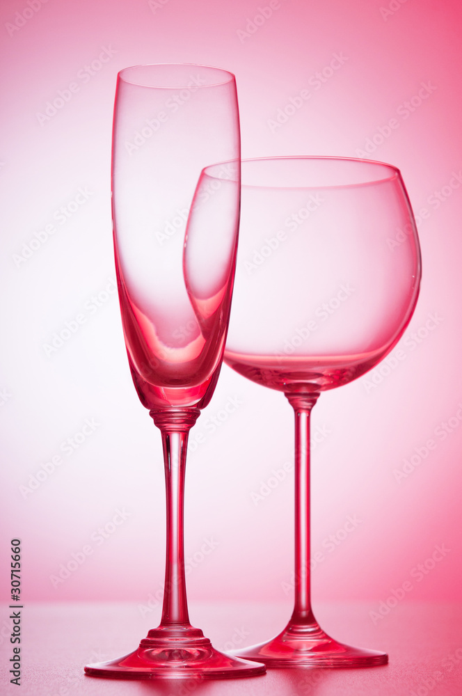 Wine glasses against gradient background Wine glasses against gradient background