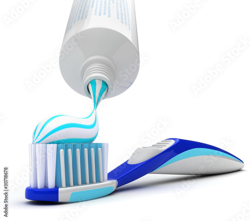 Squeezing toothpaste onto toothbrush