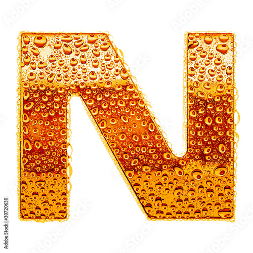 Orange gold alphabet symbol - letter N. Water splashes and drops photo