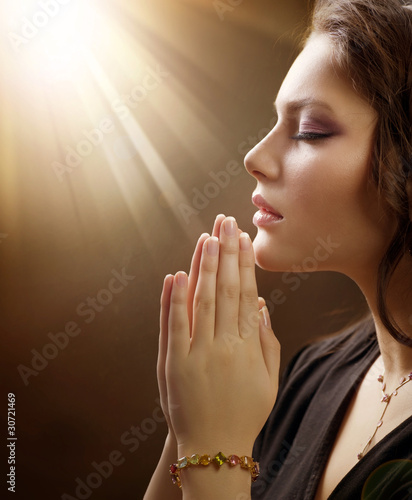 Portrait of a girl praying