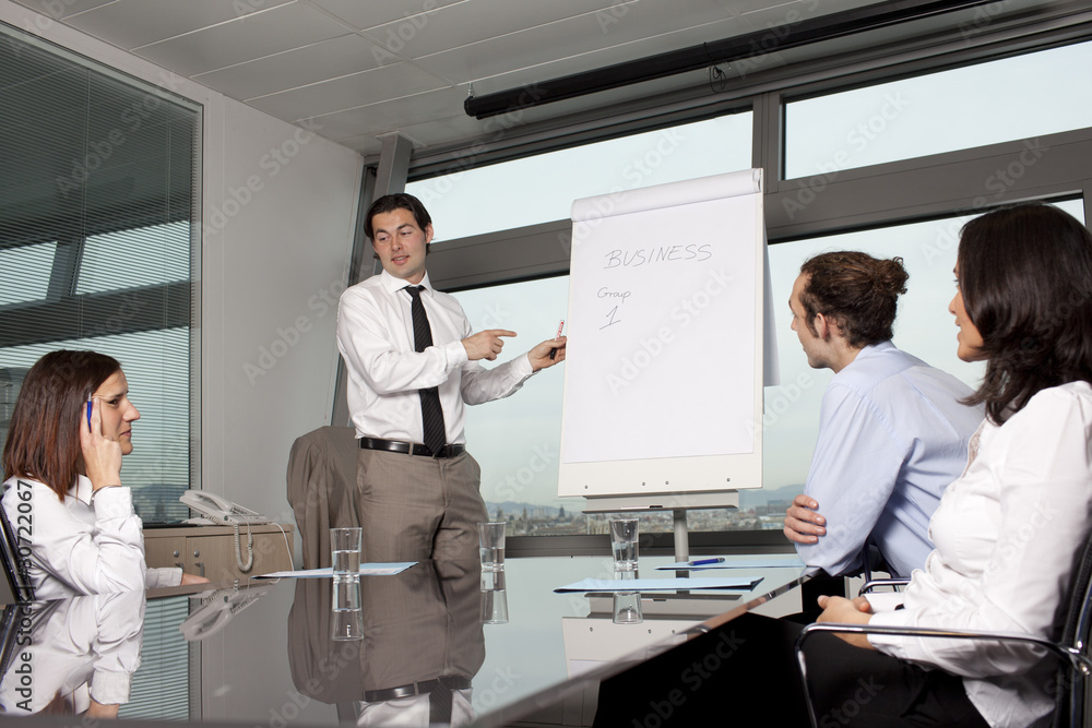 Business training in front of a panorama window Business training in front of a panorama window