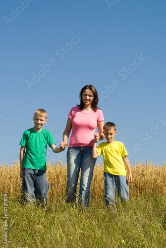 family of three on the nature