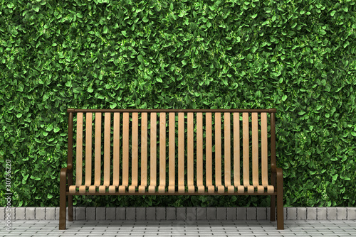 wooden bench in front of green hedge in the park