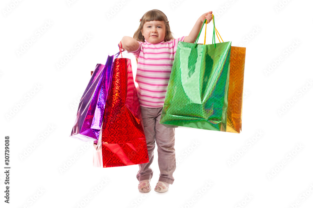 Little smiling girl with bags