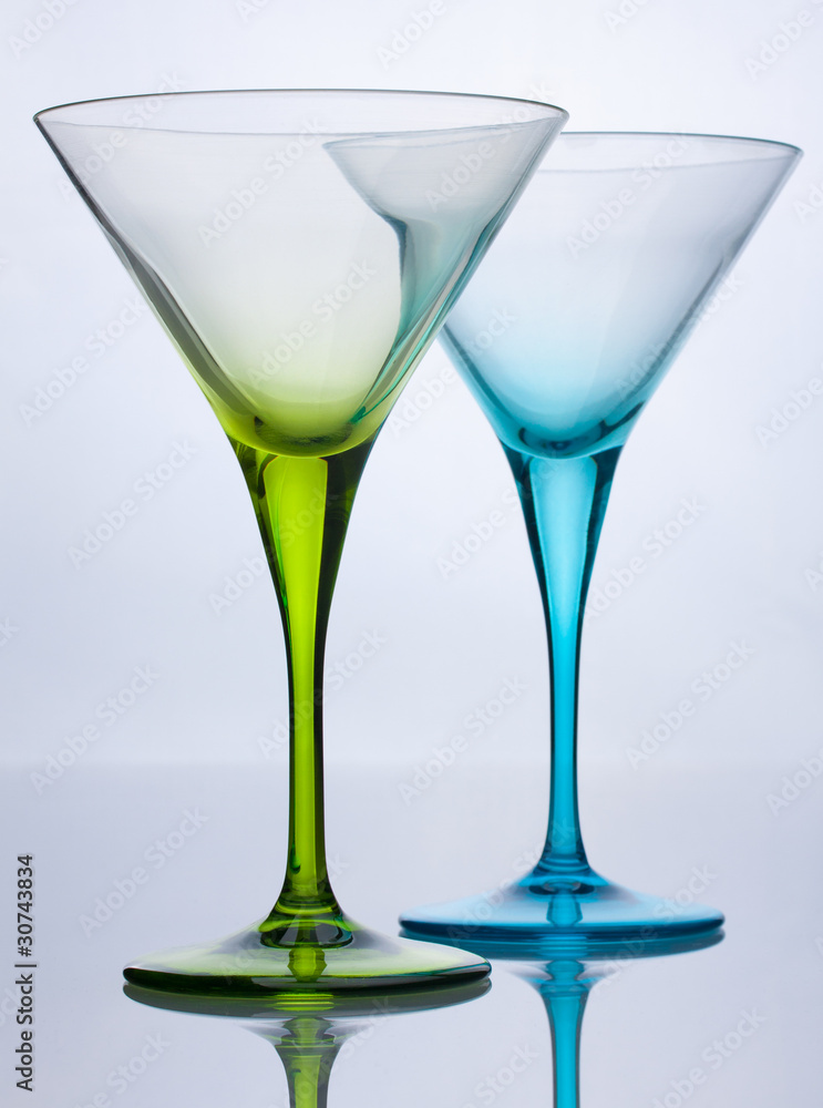 Green and blue empty cocktail glasses Green and blue empty cocktail glasses