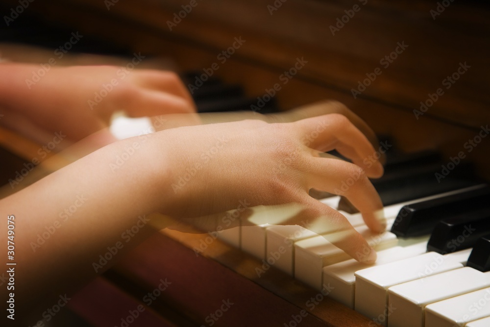 Fototapeta premium A Person Playing The Piano
