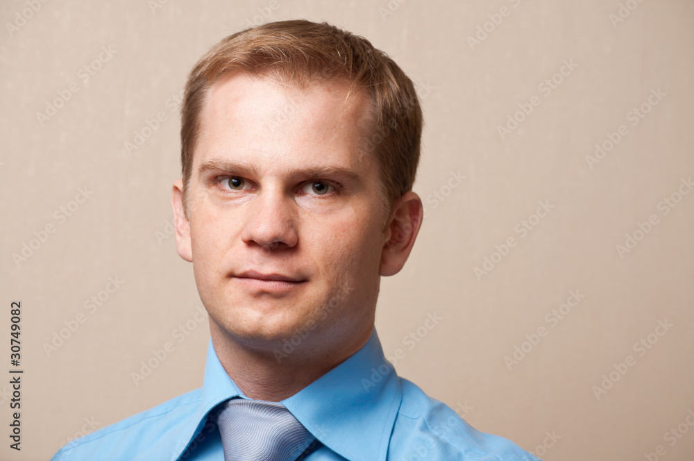 portrait of a young thoughtful businessman portrait of a young thoughtful businessman