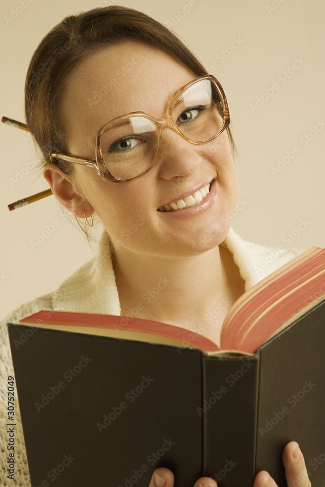 Woman Smiling And Reading Book Woman Smiling And Reading Book