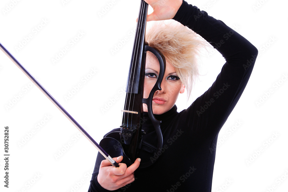 Attractive violinist playing the electric violin Attractive violinist playing the electric violin
