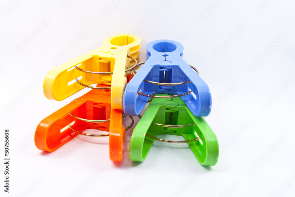 Fototapeta premium Colorful clothes pegs isolated on white background