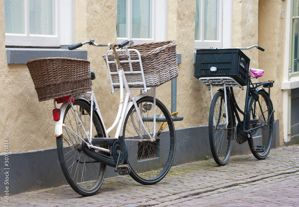 two bicycles with baskets