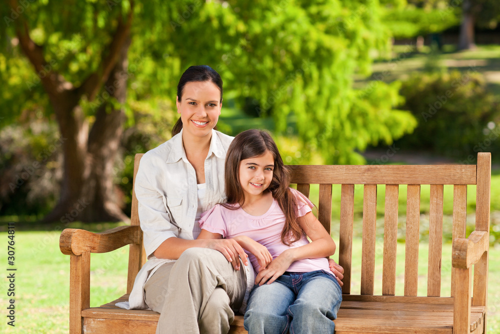 Mother and her daughter on the bench Mother and her daughter on the bench