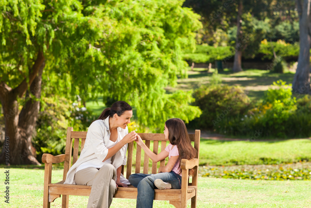 Cute girl with her mother in the park Cute girl with her mother in the park